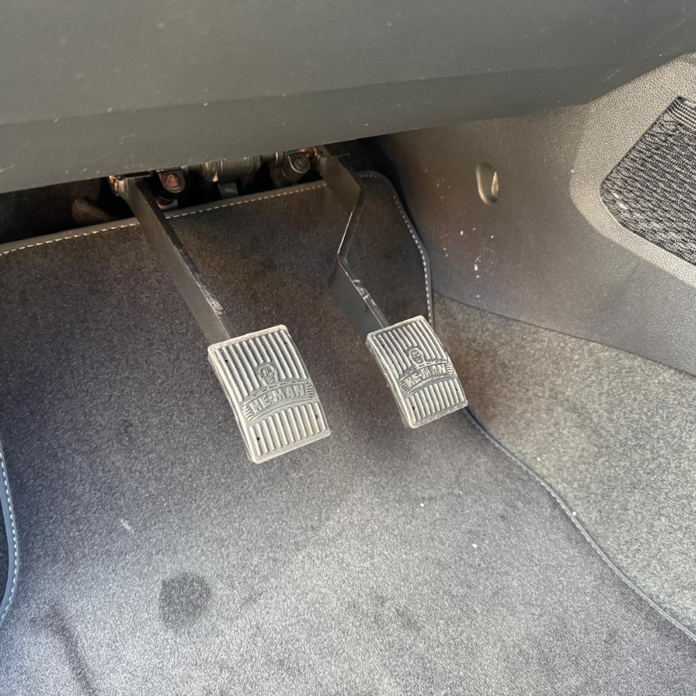 he-man dual control pedals installed in a car
